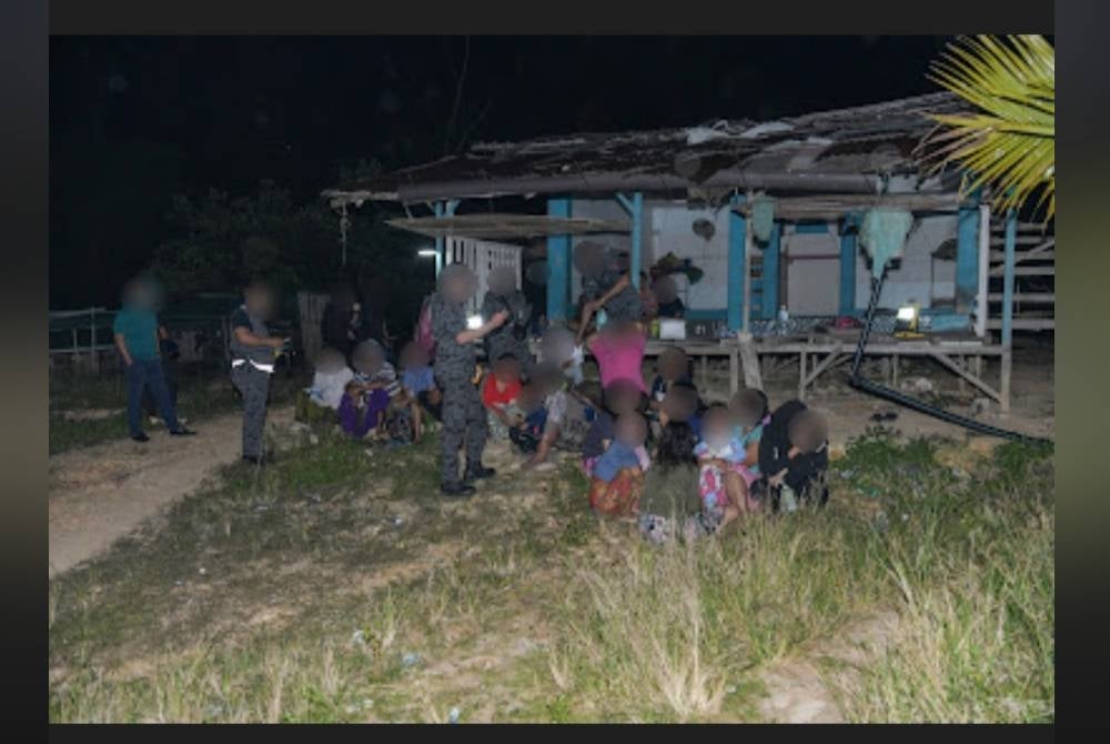 Sebahagian warga asing ditahan dan diperiksa pihak imigresen dalam satu serbuan di Puncak Alam, Selangor pada Sabtu.