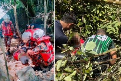Mangsa yang cedera akibat dihempap pokok ketika mandi di Air Terjun Batu Bertenggek, di sini, pada Khamis. - Foto JBPM Selangor