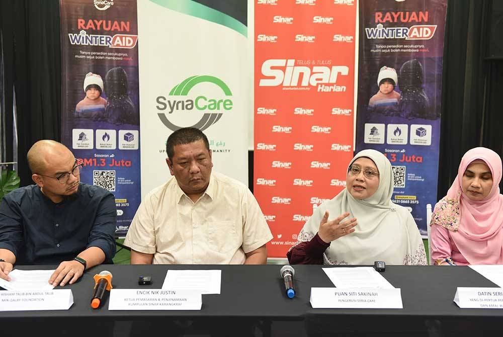 (Dari kiri) Hisham Talib, Nik Justin, Siti Sakinah dan Masdiana dalam sidang akhbar Projek Winter Aid 11.0 pada Selasa.