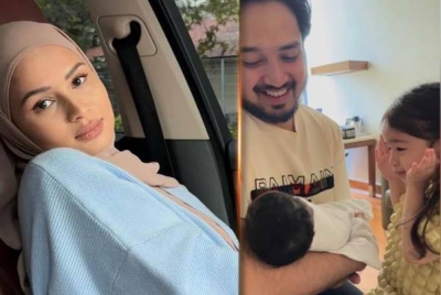 Izara Aishah memuat naik video Adib sedang memangku bayi yang baru dilahirkan sambil diperhatikan anak pertamanya, Irisa Alaia. Foto Instagram Izara Aishah