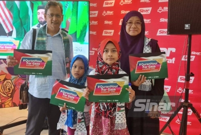 Lokman (kiri) bersama isterinya, Nor Eda dan cucunya, Salwa Ardini Mohd Shaifuddin, 9, dan Nur Alia Humairah, 7, menyertai #QuranHour For Gaza di Kumpulan Karangkraf pada Ahad.
