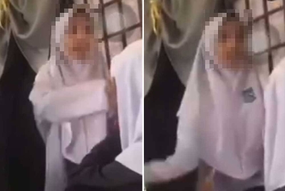 Video tular memaparkan suspek menampar rakan sekelasnya di sebuah sekolah dekat sini pada Jumaat.