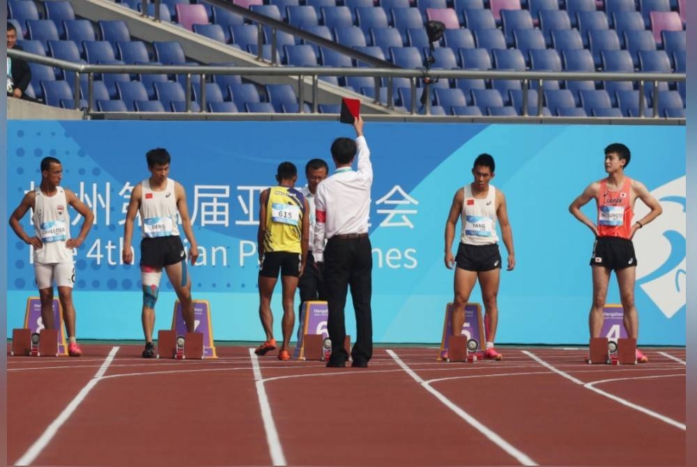 Mohamad Ridzuan melakukan ‘false start’ ketika memulakan larian acara akhir itu membuatkan penyertaannya terbatal. - Foto Bernama