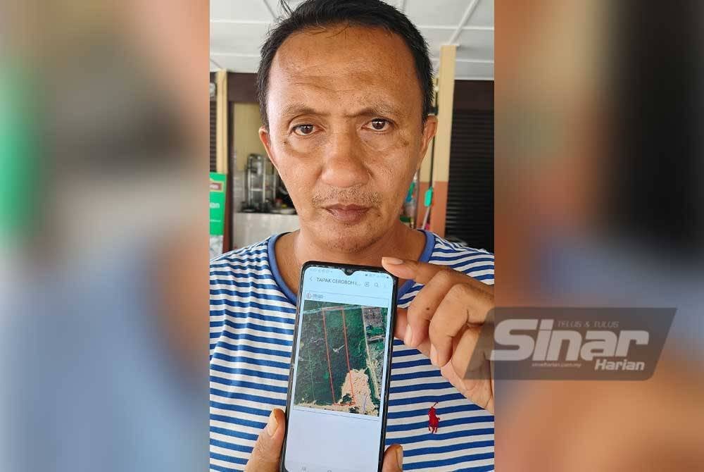 Wan Udani menunjukkan kedudukan kebun milik keluarganya di Beserah yang diceroboh dan ditarah pihak lain tanpa pengentahuannya.