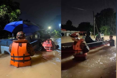 
Anggota bomba memindahkan mangsa banjir di Kampung Paya Kenanga menggunakan bot. - Foto BBP Tebrau