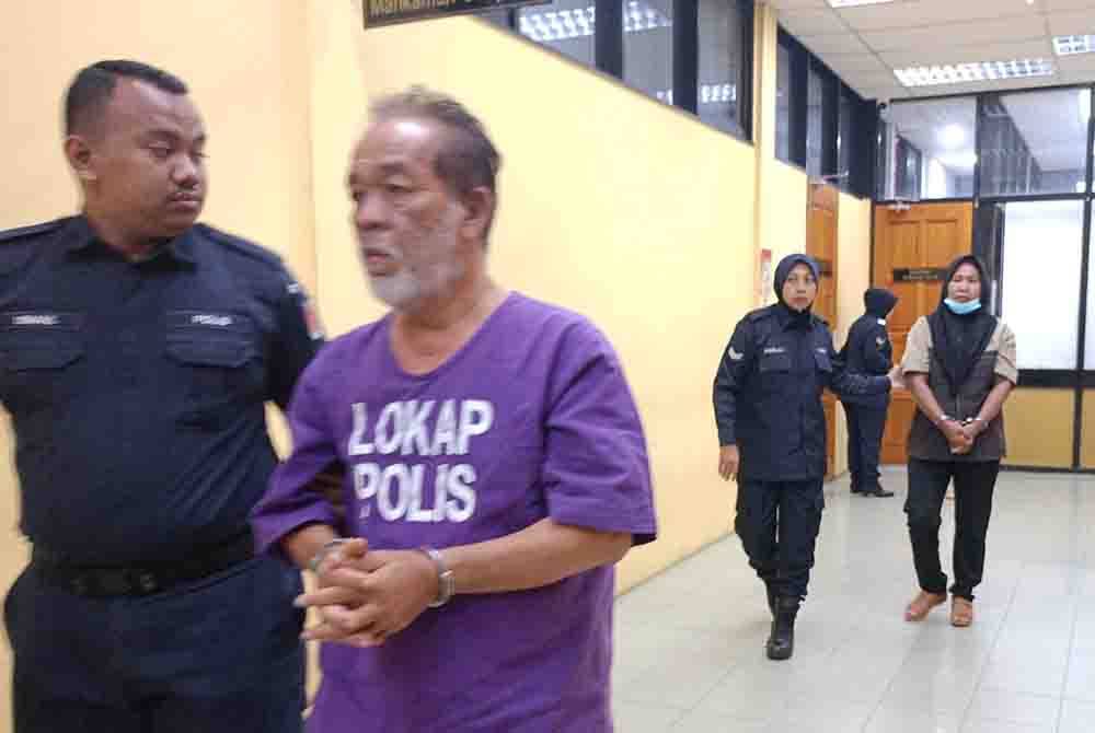 Kamarulzaman dan isterinya, Supiani dibawa keluar dari Mahkamah Sesyen Teluk Intan pada.Selasa selepas dituduh mengangkut 10 migran yang diseludup masuk ke negara ini, bulan lalu. Foto: ihsan pembaca