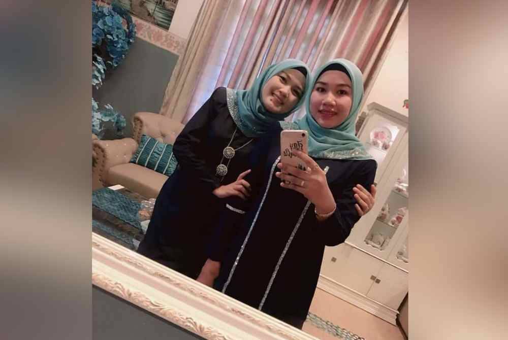 Norhisham (kiri) bergambar dengan Bella (kanan).