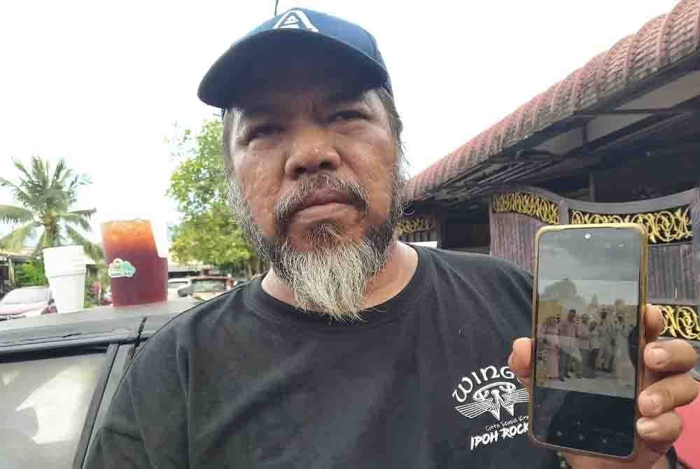 Borhan ketika ditemui pemberita di rumahnya di Taman Bercham Raya di sini menunjukkan gambar ketika Allahyarham Hamdan hadir ke majlis perkahwinan anaknya pada September tahun lalu.