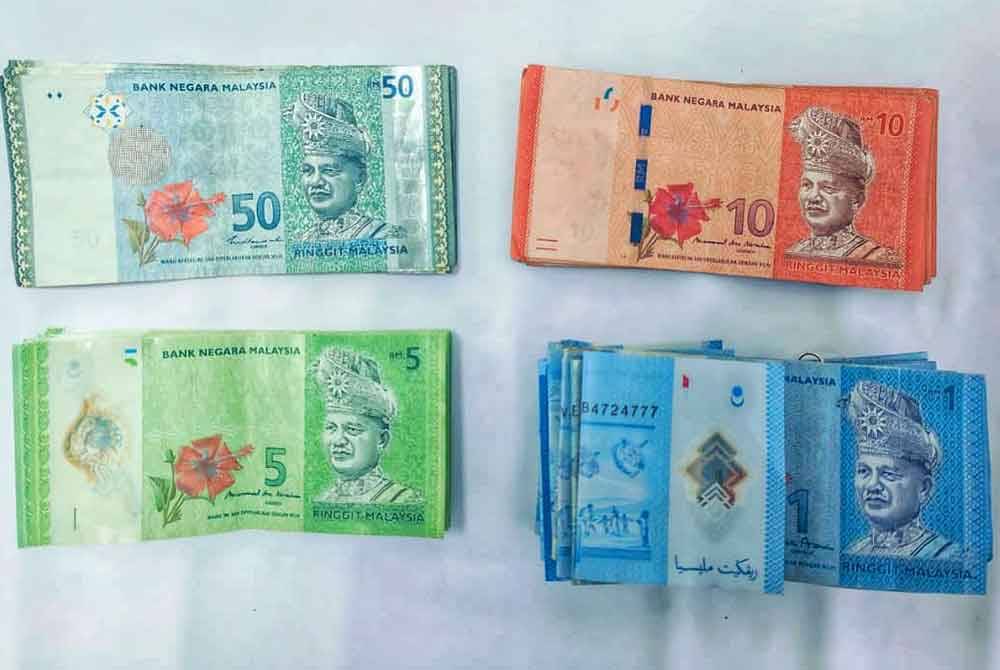 Wang tunai bernilai RM560 yang turut disita. Foto Ihsan PDRM