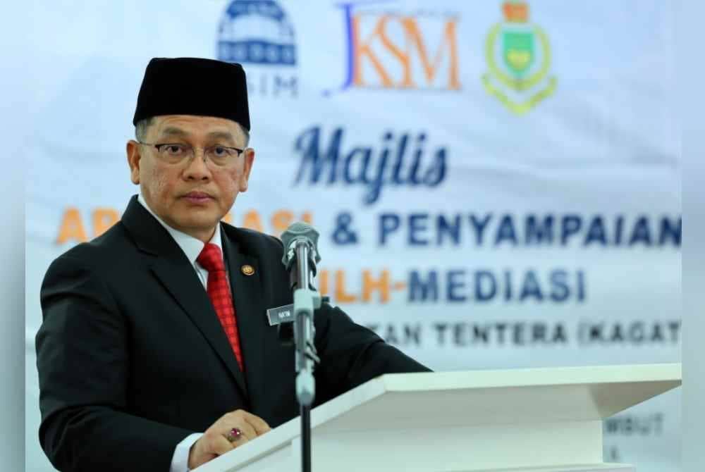 Mohd Na'im ketika berucap pada Majlis Apresiasi Dan Penyampaian Sijil Profesional Kemahiran Sulh_Mediasi (USIM-JKSM) untuk anggota KAGAT di Jabatan Kehakiman Syariah hari ini. Foto Bernama