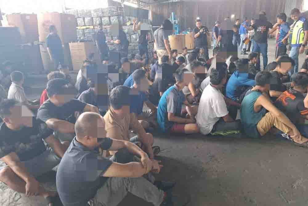 Antara pekerja asing yang ditahan dalam Op Khas Aman 1 di premis kilang sekitar Kapar, Klang pada Selasa.