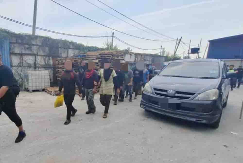 Antara pekerja asing yang ditahan dalam Op Khas Aman 1 di premis kilang sekitar Kapar, Klang pada Selasa.