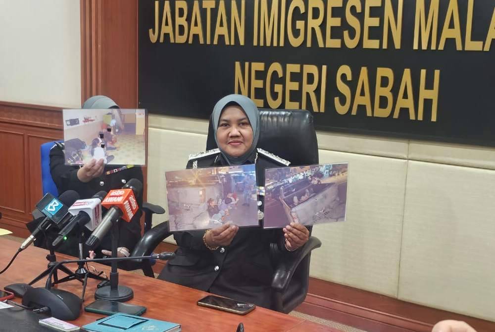 Sharifah Sitti Saleha menunjukkan gambar PATI yang ditahan dalam operasi penguatkuasaan di Penampang.