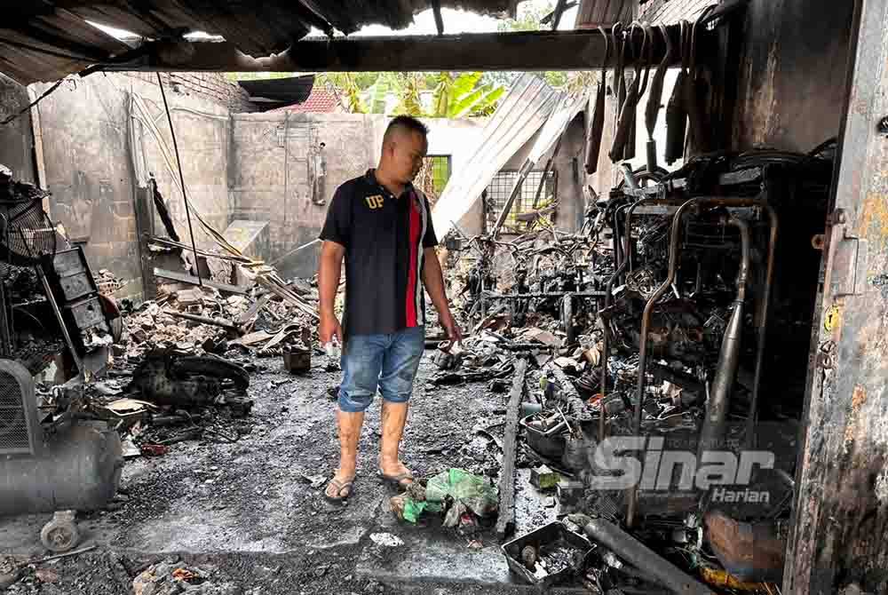 Bengkel motosikal yang terbakar di Kampung Biah, Perol, Kota Bharu pada Khamis.