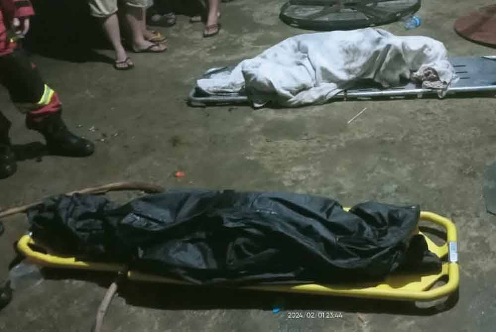 Mayat dua mangsa rentung ditemukan di bahagian bilik rumah yang terbakar di Kampung Matan, Ranau.