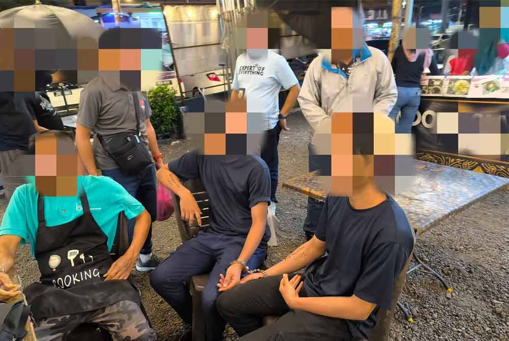 Sebahagian warga asing yang ditahan imigresen Johor dalam Ops Selera pada Khamis. Foto JIM Negeri Johor