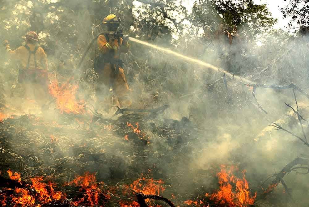 Musim panas yang melanda beberapa negara di Asia Tenggara telah mengakibatkan kebakaran hutan dan ladang secara tidak terkawal. -Foto: AFP