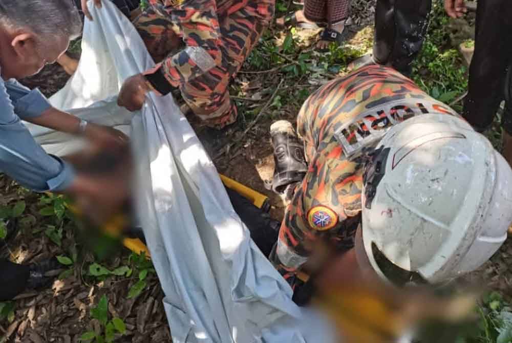 Mayat Mohd Irfan Abdullah, 13, ditemukan oleh bapanya yang turut menyertai operasi SAR. Foto JBPM