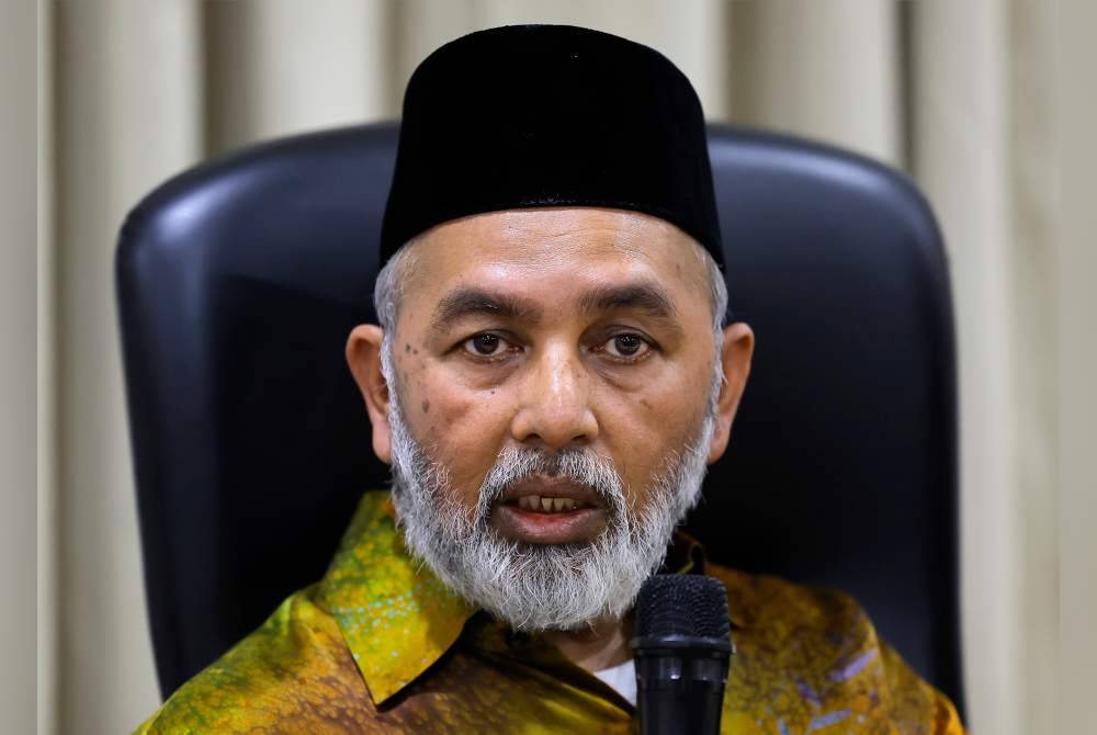Syed Abu Hussin Hafiz bercakap pada sidang media mengenai harga beras tempatan di Cyberjaya pada Khamis. Foto Bernama