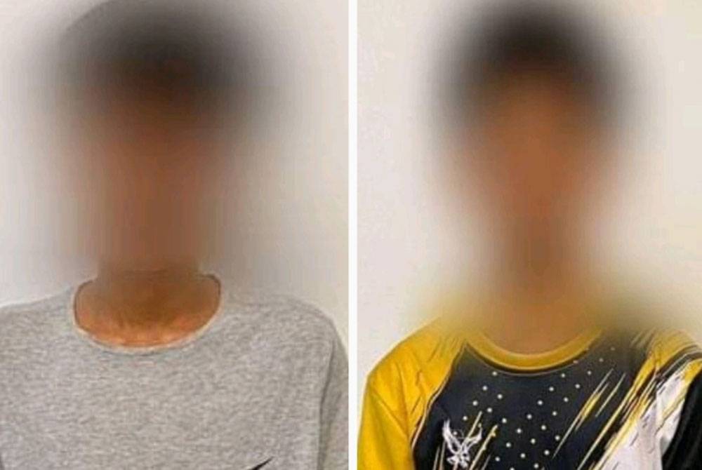 Dua remaja yang ditahan kerana melakukan aksi 'superman' di Kilometer 47 Jalan Kuantan- Segamat. Foto PDRM