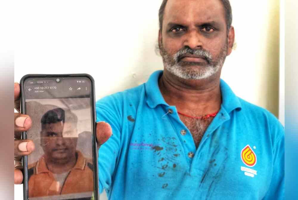 Manivannan menunjukkan gambar adiknya yang maut dalam kemalangan terbabit.