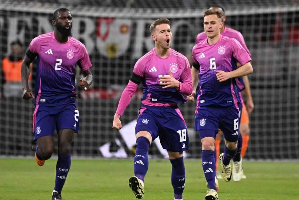 Reaksi Mittelstadt (tengah) selepas menjaringkan gol penyamaan buat Jerman. FOTO: AFP