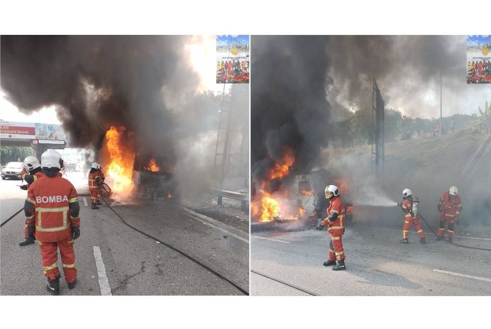 Anggota bomba menjalankan kerja pemadaman sebuah lori membawa muatan pasir yang terbakar dalam kejadian dekat Kilometer 11.2 Lebuhraya Duta-Ulu Kelang (DUKE) di sini pada Sabtu.