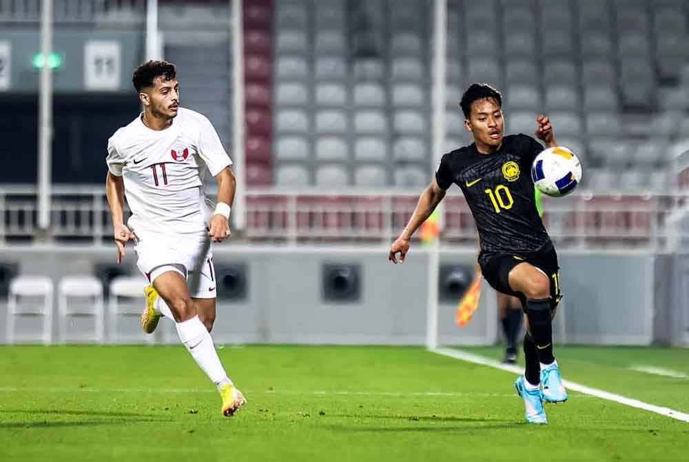 Aksi pemain Harimau Muda, Luqman Hakim Shamsudin ketika perlawanan persahabatan di Stadium Abdullah bin Khalifa, Doha. Foto Football Association of Malaysia