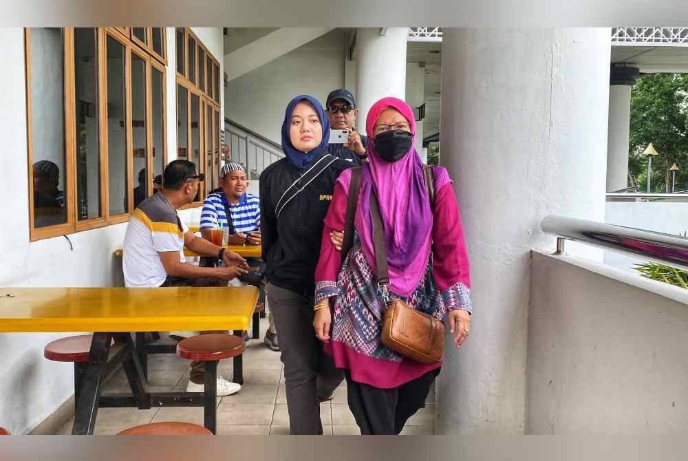 Tertuduh, Fadziyani Mohamed diiringi pegawai SPRM selepas mendengar pendakwaan terhadapnya pada Isnin.