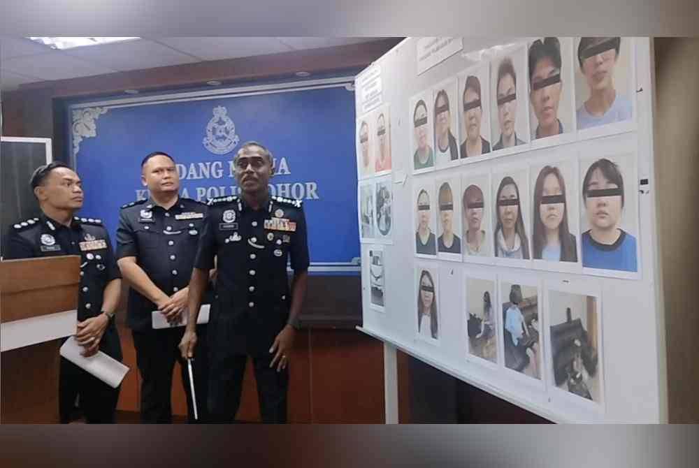 M Kumar menunjukkan suspek yang ditahan hasil serbuan di tiga rumah mewah dijadikan 'calling centre' pelaburan tidak wujud.