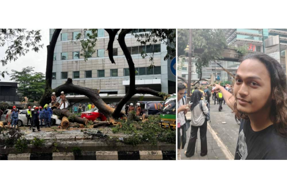 Muhammad Tariq (kanan) menunjukkan lokasi kejadian pokok tumbang di Jalan Sultan Ismail, Kuala Lumpur pada Selasa.