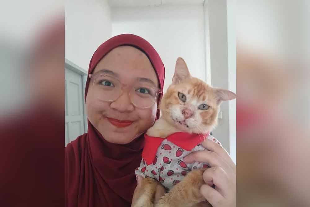 Wan Yusmanira (kiri) dan Romlee (kanan).