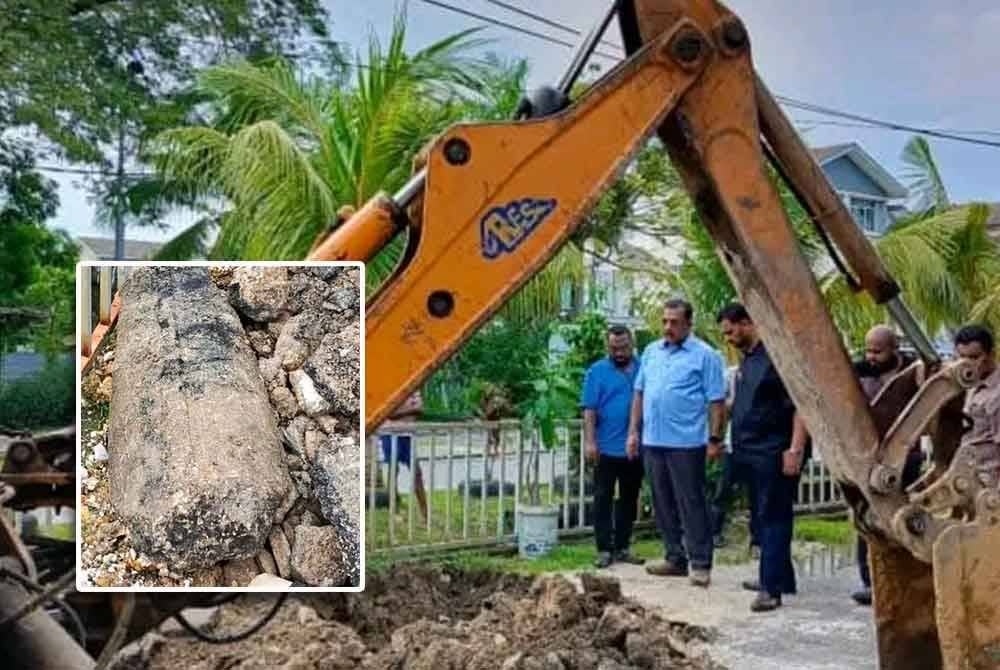Gunaraj (tengah) meninjau kerja-kerja penggalian bagi mengeluarkan batu konkrit di dalam longkang di Jalan Bendahara 14 di sini pada Khamis. Gambar kecil: Batu konkrit yang berjaya dikeluarkan selepas kerja-kerja penggalian dijalankan.