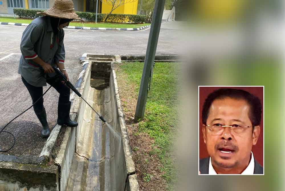 Pekerja pembersihan mencuci longkang dengan menggunakan alat pancutan air bertekanan tinggi. Gambar kecil: Abdul Rahman