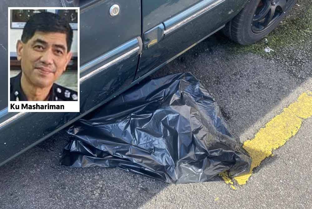 Mayat bayi perempuan yang ditemui di bawah kereta Proton Iswara di sebuah pangsapuri di Pantai Dalam di sini, Jumaat lalu.