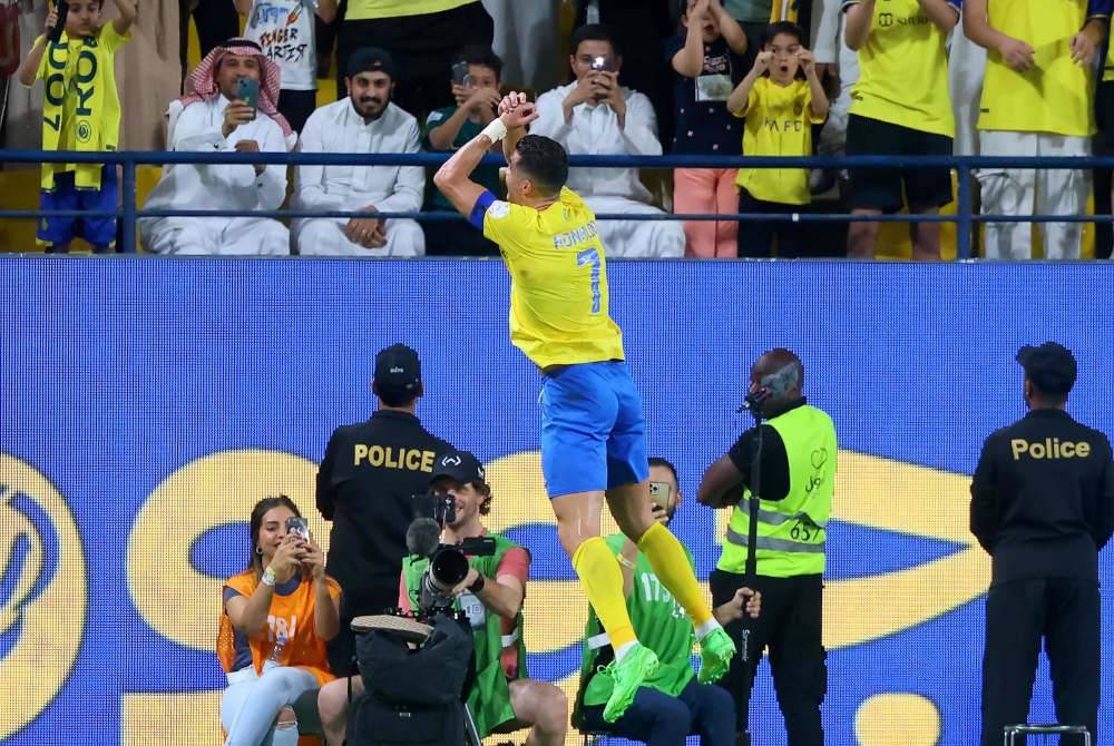 Ronaldo meraikan jaringannya ketika menentang Al-Ittihad. Foto AFP