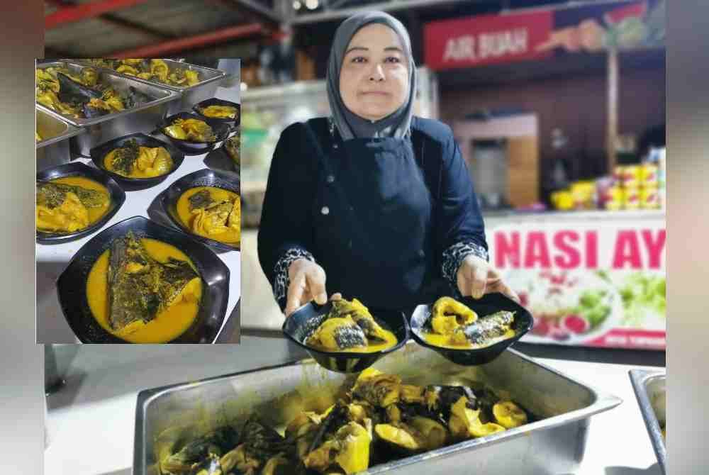 Latifah menunjukkan hidangan baung masak tempoyak yang siap dimasak dan sedia dihidangkan kepada pelanggan. Ikan baung masak tempoyak di restoran Mr Baung yang beroperasi di Kampung Basung, Hulu Terengganu tidak pernah lekang daripada menerima pelanggan sepanjang musim cuti sekolah.