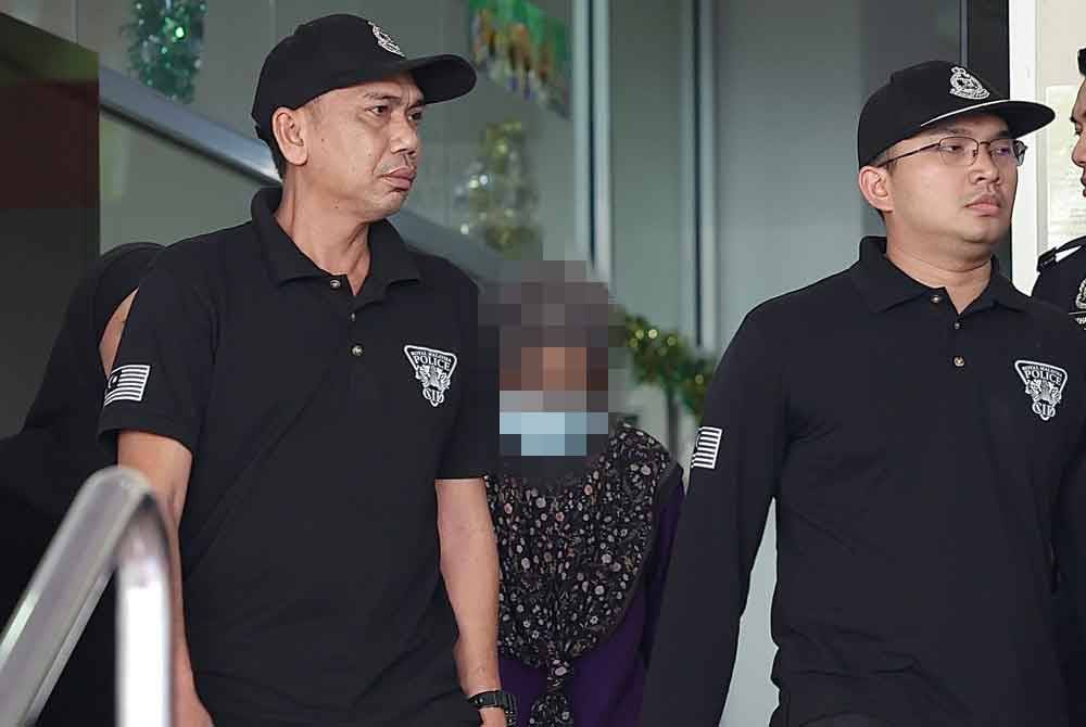 Ibu kepada Zayn Rayyan dibawa keluar dari Kompleks Mahkamah Petaling Jaya pada Rabu selepas menghadiri satu prosiding tertutup berhubung kes pembunuhan kanak-kanak terbabit. Foto Bernama