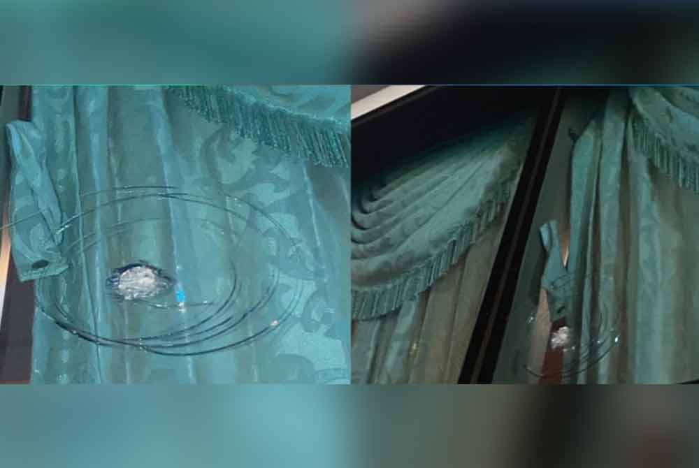 Kesan kerosakan pada bas yang membawa penyokong Perak selepas dibaling batu dua individu di Lebuhraya NKVE, pada Ahad.