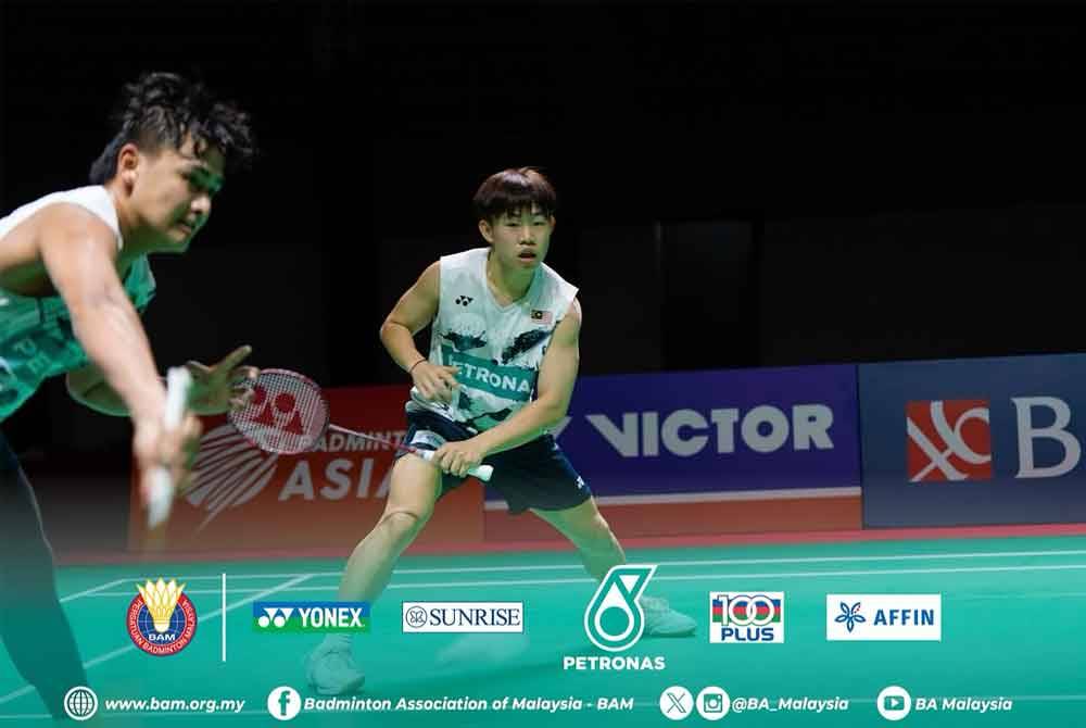 Beregu lelaki negara, Kang Khai Xing-Aaron Tai berjaya mencuri mata pertama dengan menewaskan Hu Ke Yuan-Lin Xiang Yi 26-24, 25-23. - Foto: FB BAM