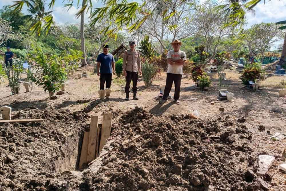Polis sedang menjalankan siasatan terperinci berhubung motif kubur wanita itu digali. Foto Agensi