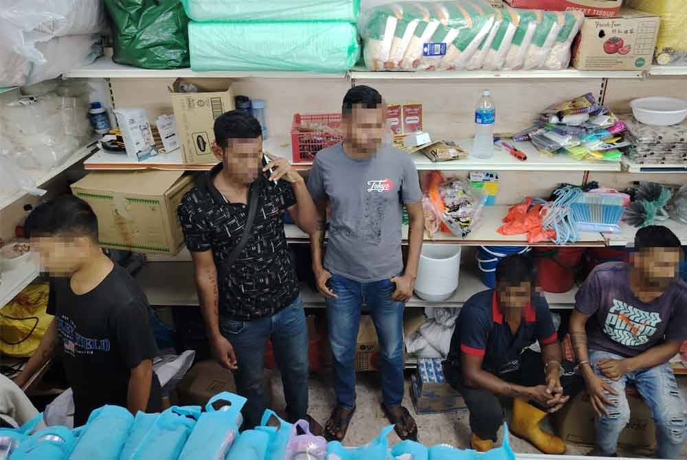 Antara warga asing yang diperiksa JIM Kuala Lumpur dalam operasi di Jalan Ipoh, Kuala Lumpur pada Jumaat.