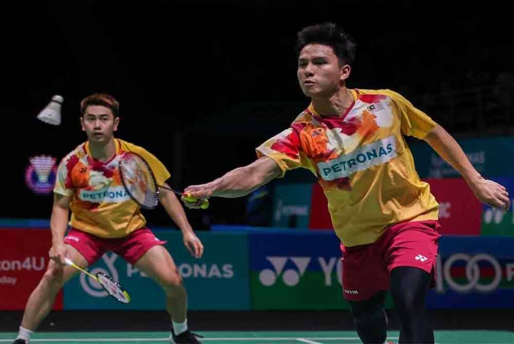 Sze Fei (kiri) dan Nur Izzuddin memulakan Kejohanan Badminton Terbuka Jepun dengan langkah kanan. Foto Agensi.
