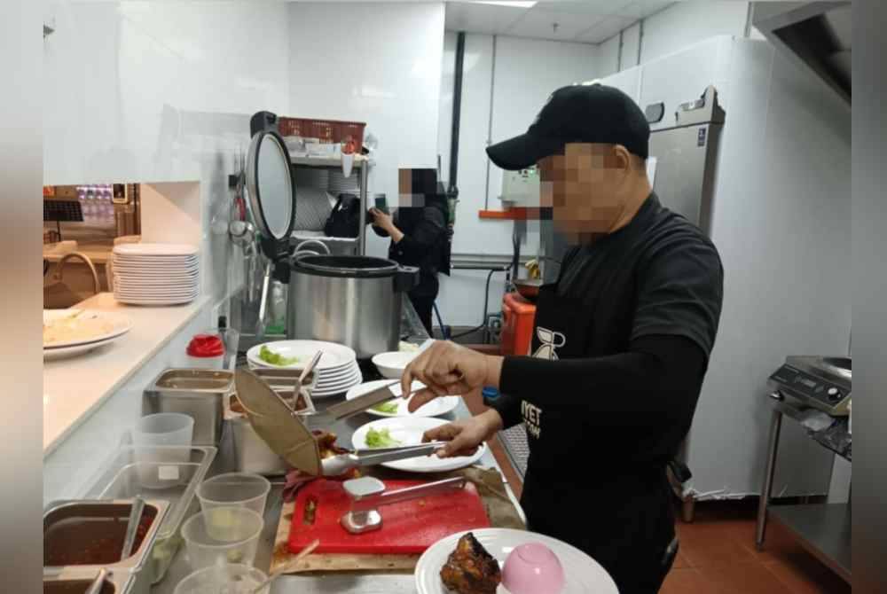 Seramai 27 pengendali makanan diperiksa sebelum 11 pekerja berusia 25 hingga 40 tahun ditahan atas pelbagai kesalahan. Foto JIM Pulau Pinang