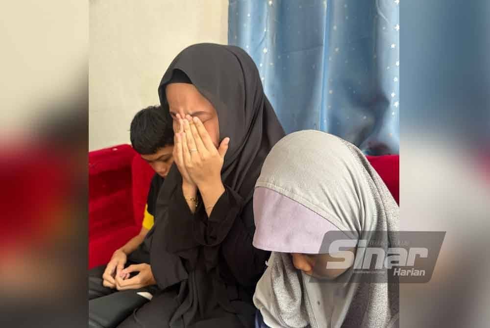 Nurul Natasha Elias (tengah) yang bersedih menunggu kepulangan ibu mereka. Foto Sinar Harian/ADILA SHARINNI WAHID