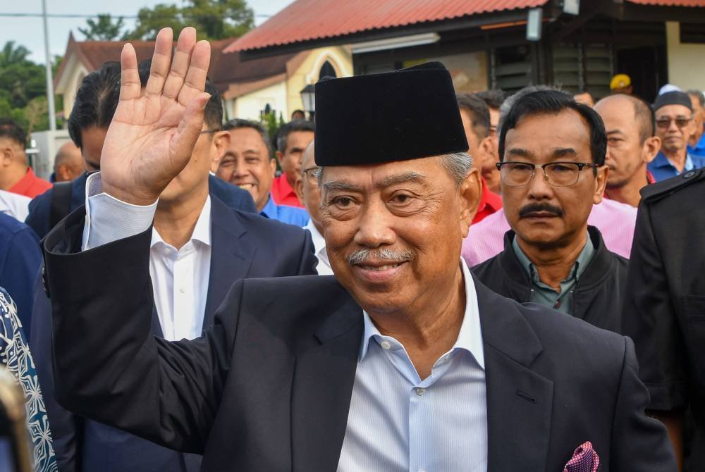 Muhyiddin ketika tiba di Kompleks Mahkamah Gua Musang pada Selasa bagi menghadapi pendakwaan berhubung ucapan yang dikatakan menyentuh isu 3R. Foto Bernama