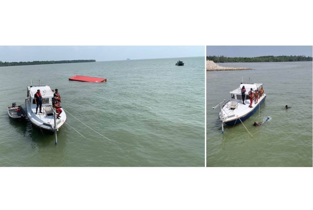 Usaha mencari mangsa giat dijalankan anggota bomba di Pelabuhan Barat pada Ahad.