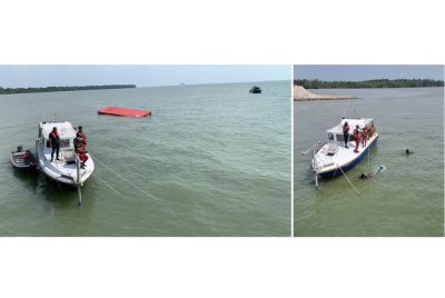 Usaha mencari mangsa giat dijalankan anggota bomba di Pelabuhan Barat pada Ahad.
