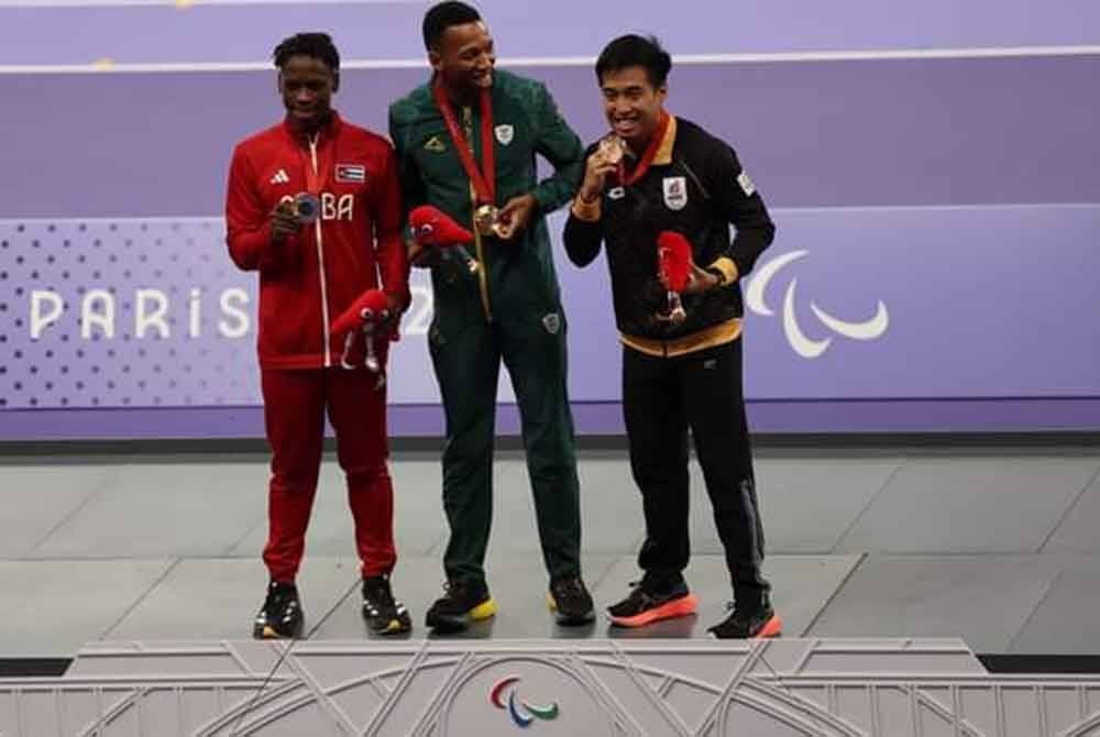 Eddy (kanan) bersama pemenang pingat lain. Foto: MSN