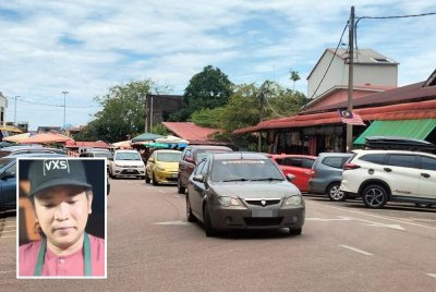 Kenderaan pengunjung tidak putus-putus memasuki bandar Rantau Panjang pada cuti umum. Gambar kecil: Adrian Hakimi